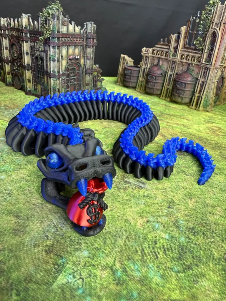 Photo of a 3d-printed dragon with a money bag in its mouth