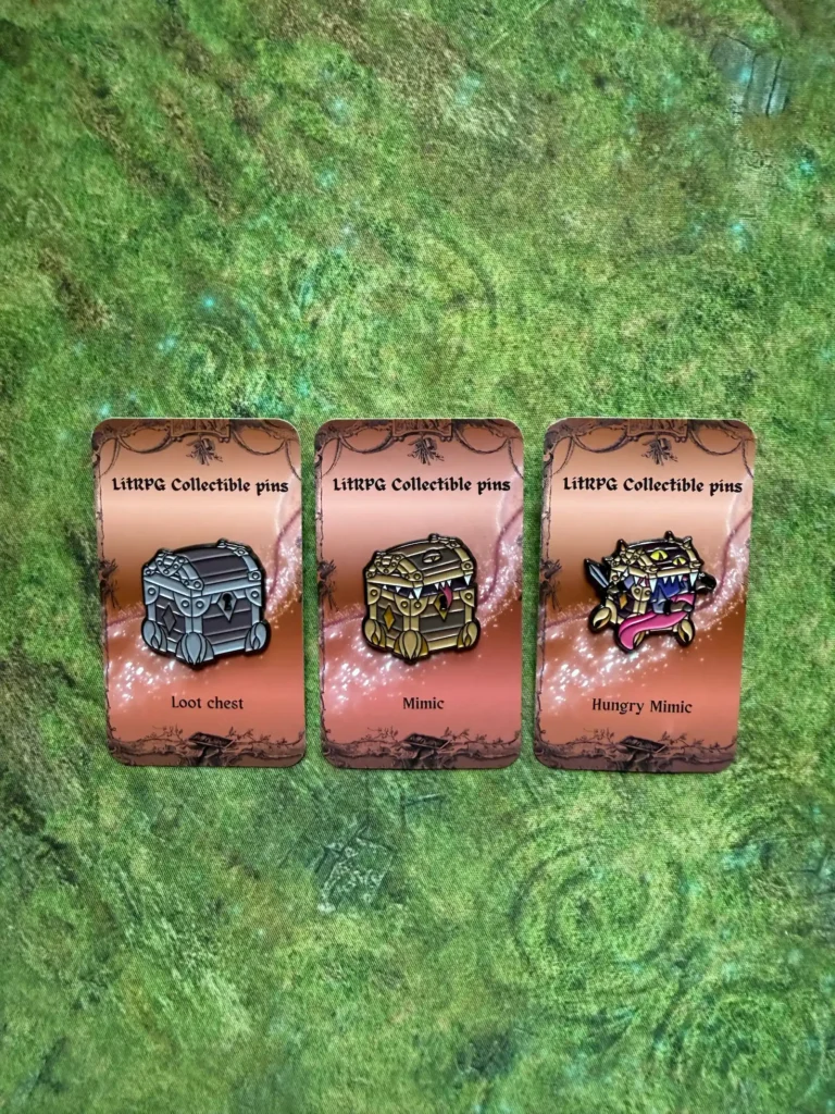Loot chest, Mimic and Hungry Mimic pins on a green mat